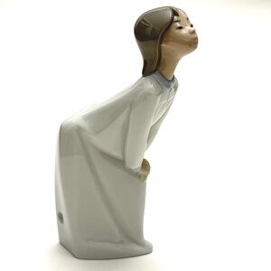 Lladro "Girl Kissing" porcelain figurine, #4873. First issued 1973, retired 1999